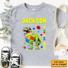 Puzzles and Dinosaurs - Personalized Name Colourful Graphic T-Shirt - A Gift for Child - OLESA